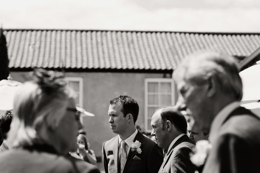 Groom chats with guests